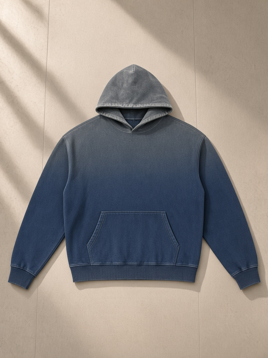 Vintage Washed Gradient Fleece Hoodie in Navy Blue, laid flat on pale limestone, front.