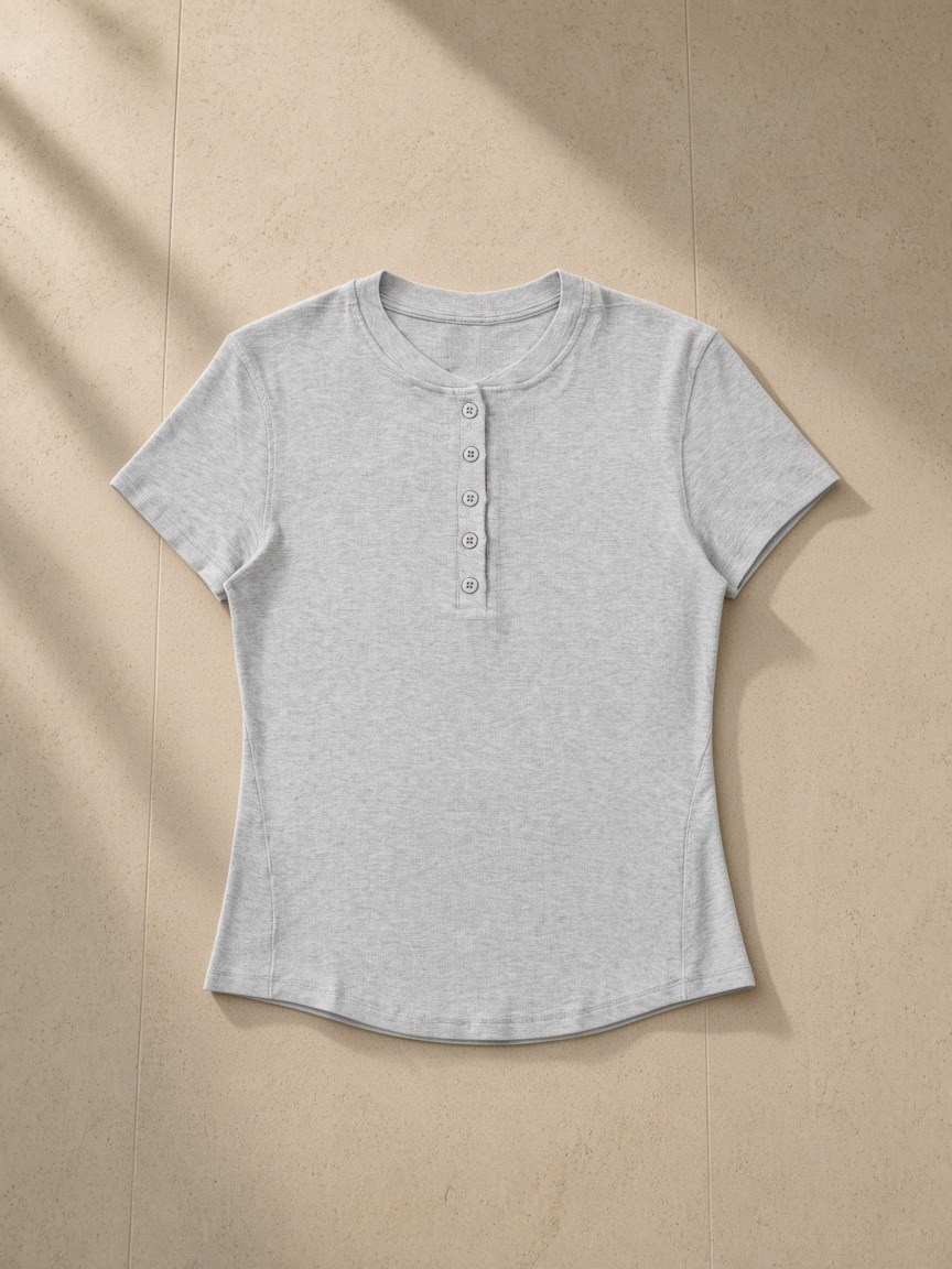 Modal bodycon henley shirt in Gray, laid flat on pale limestone