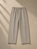 Snow Washed Straight Leg Pants in Stone Gray, laid flat on pale limestone