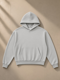 Unisex boxy darted sleeve hoodie in Flower Gray, laid flat on pale limestone