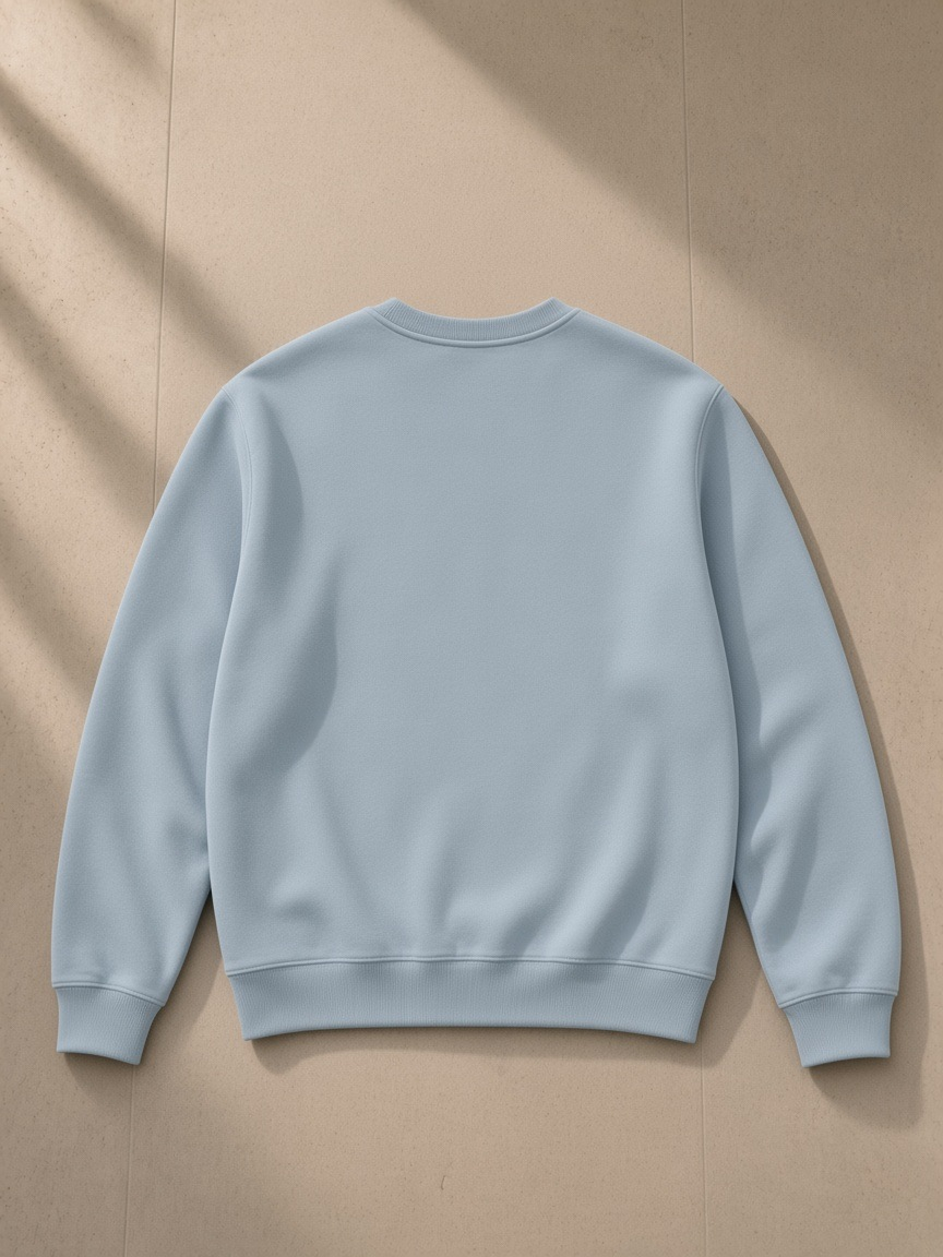 Streetwear Cotton Pullover in Ice Water, laid flat on pale limestone, back view