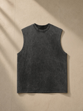 Snow Washed Frayed Hem Tank Top in Black, laid flat on pale limestone