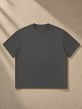 Boxy Coolmax T-Shirt in Dark Gray, laid flat on pale limestone, front.