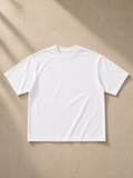 Women's Heavyweight Mineral Wash Boxy T-Shirt in White, laid flat on pale limestone