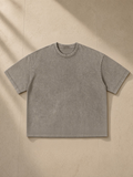 Unisex vintage wash boxy t-shirt in Light Coffee, laid flat on pale limestone
