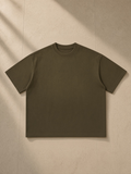 Unisex sun fade distressed boxy t-shirt in Army Green, laid flat on pale limestone