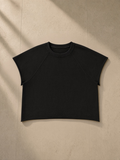 Unisex vintage wash raw edge boxy t-shirt in Black, front view on white. Marcel Afters