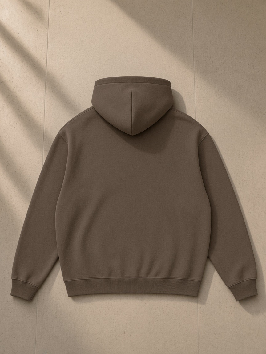 Streetwear Fleece Hoodie in Dark Brown, laid flat on pale limestone, back view