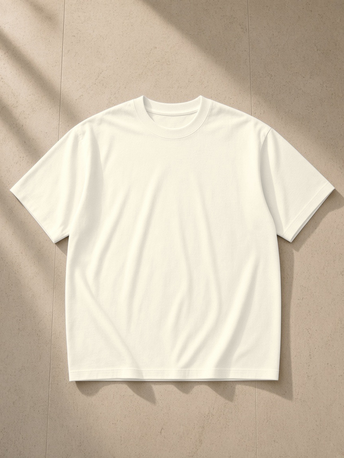 Sorona Quick-Dry Loose Fit Boxy T-Shirt in Light Apricot, laid flat on pale limestone, front.