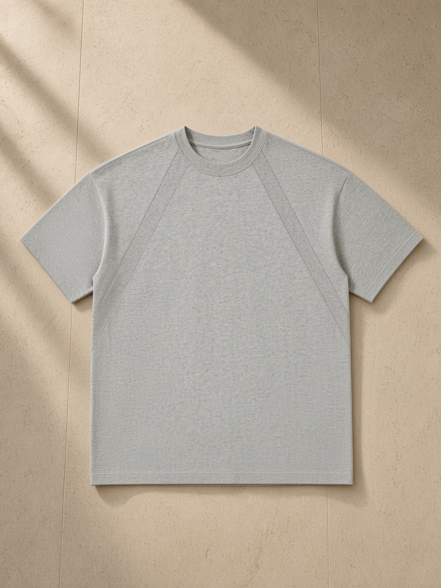 Tonal Paneled Performance T-Shirt in Flower Gray, laid flat on pale limestone