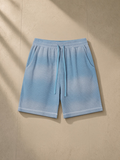 Sunfade waffle raw hem shorts in Sky Blue, laid flat on pale limestone
