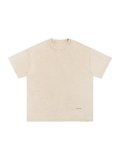 Unisex snow washed oversized cotton t-shirt in Apricot, front view on white. Marcel Afters