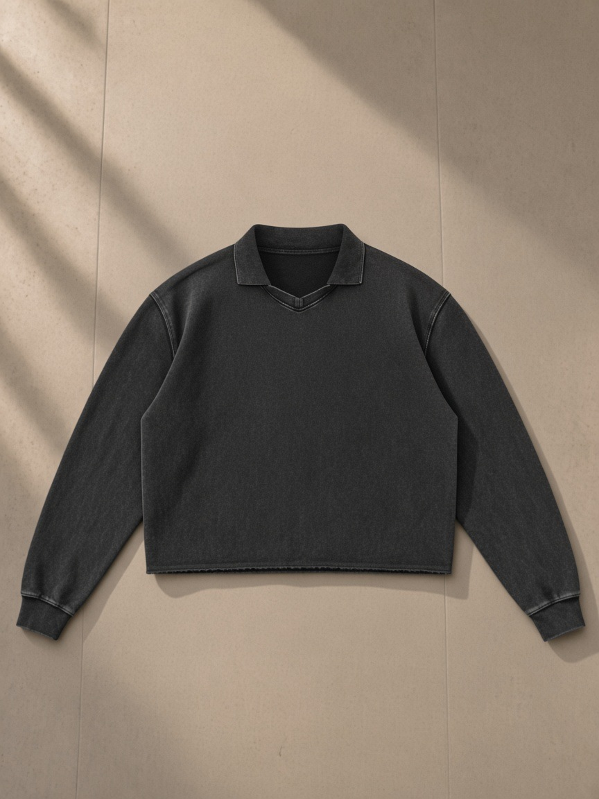 Mineral Wash Pullover Sweatshirt in Black, laid flat on pale limestone, front.