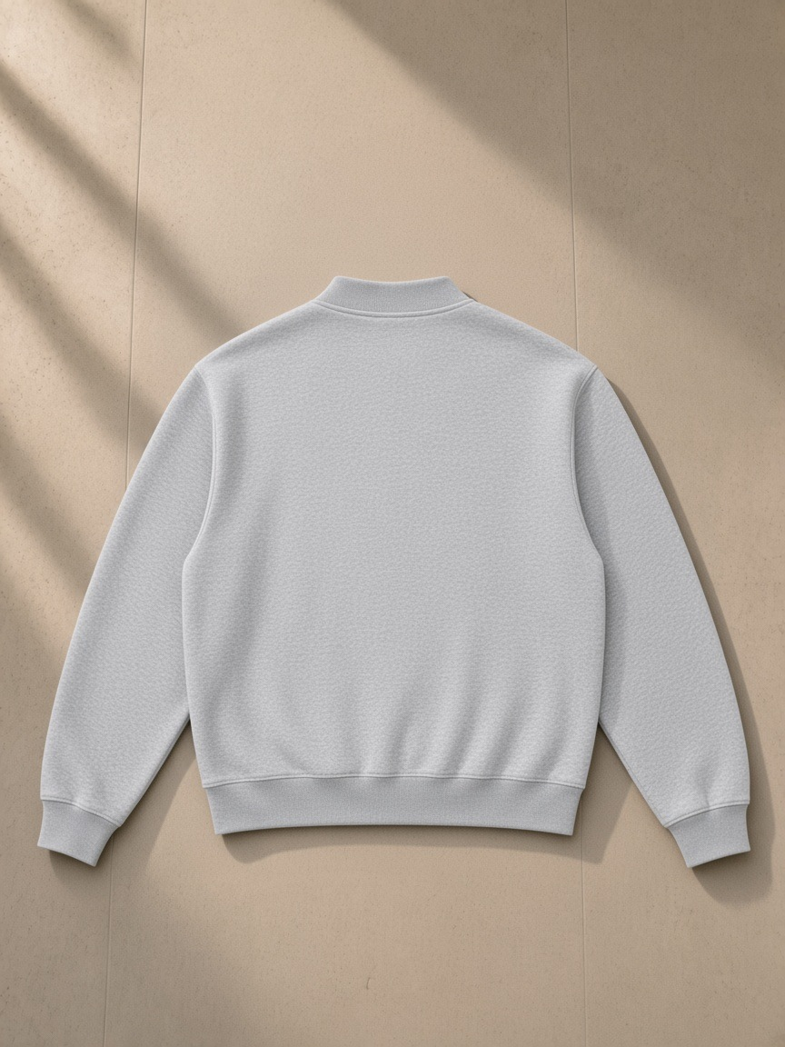 Unisex vintage wash fleece quarter zip sweatshirt in Flower Gray, laid flat on pale limestone