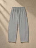 Vintage washed barrel leg sweatpants in Light Gray, laid flat on pale limestone