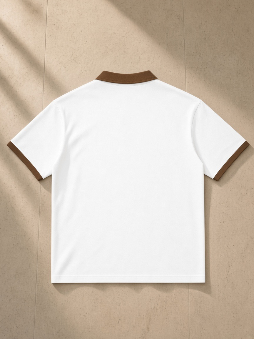 Color Block Polo Shirt in White with Brown, laid flat on pale limestone, back.