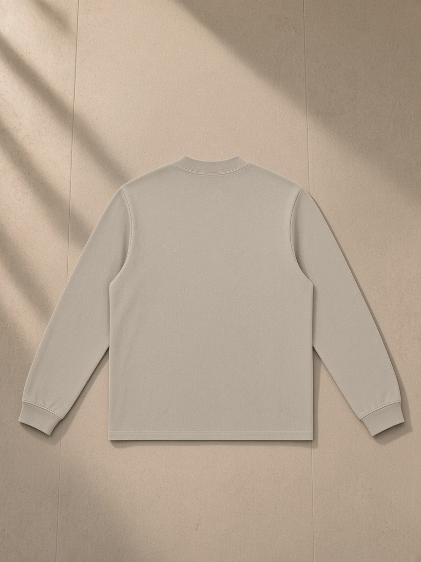 Non-shrink mock neck sweatshirt in Light Apricot, laid flat on pale limestone, back view