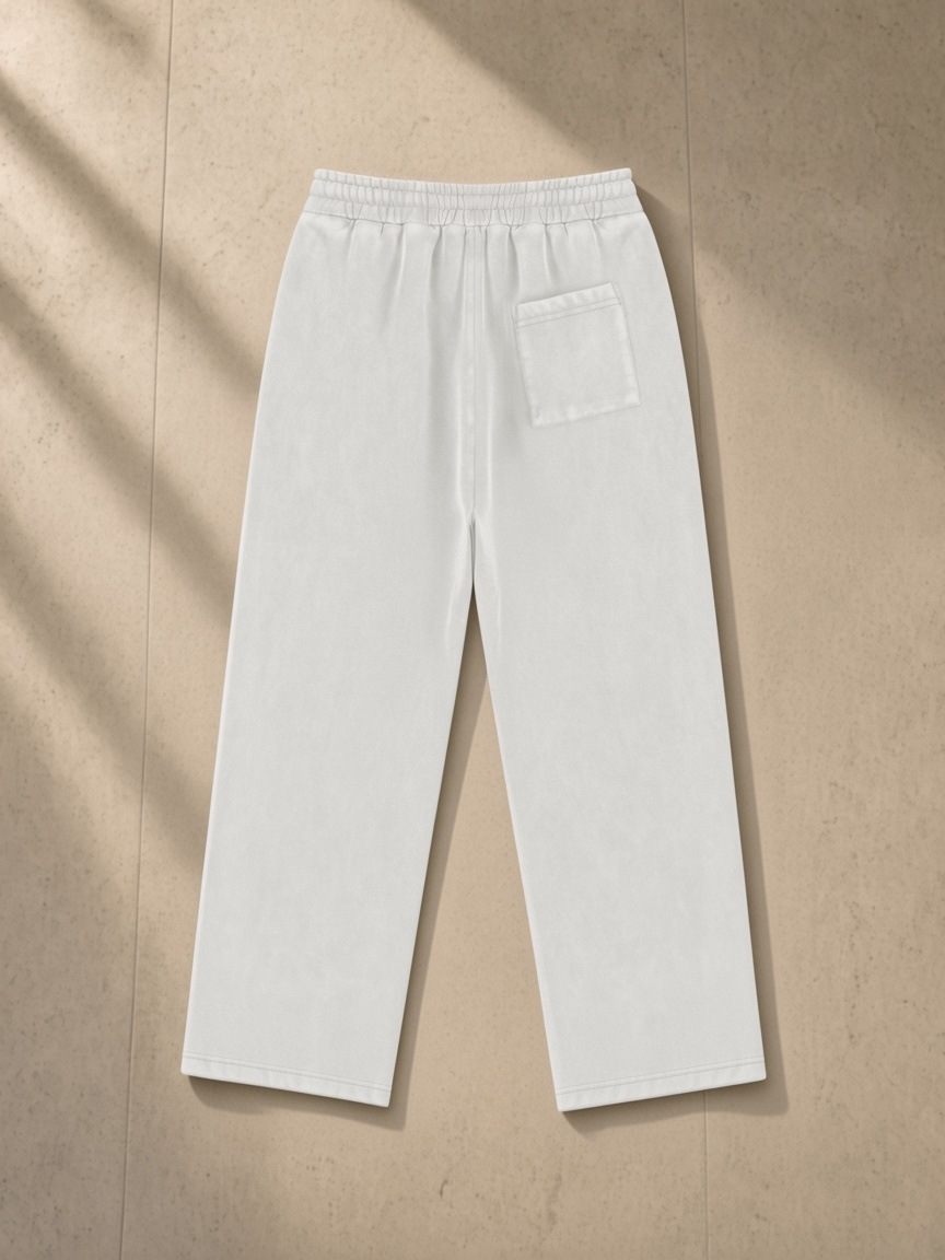 Vintage Wash Fleece Sweatpants in Light Gray, laid flat on pale limestone, back.