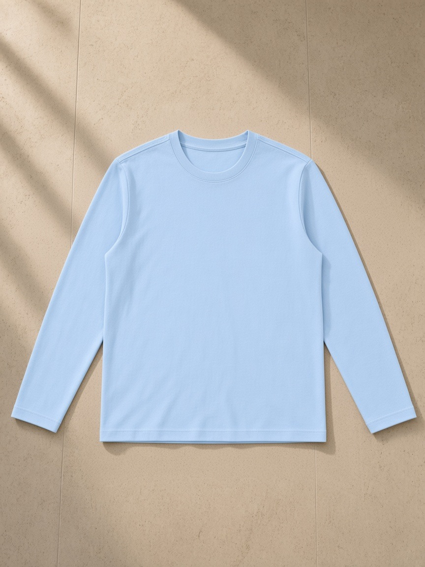 Heavyweight Long Sleeve T-Shirt in Sky Blue, laid flat on pale limestone