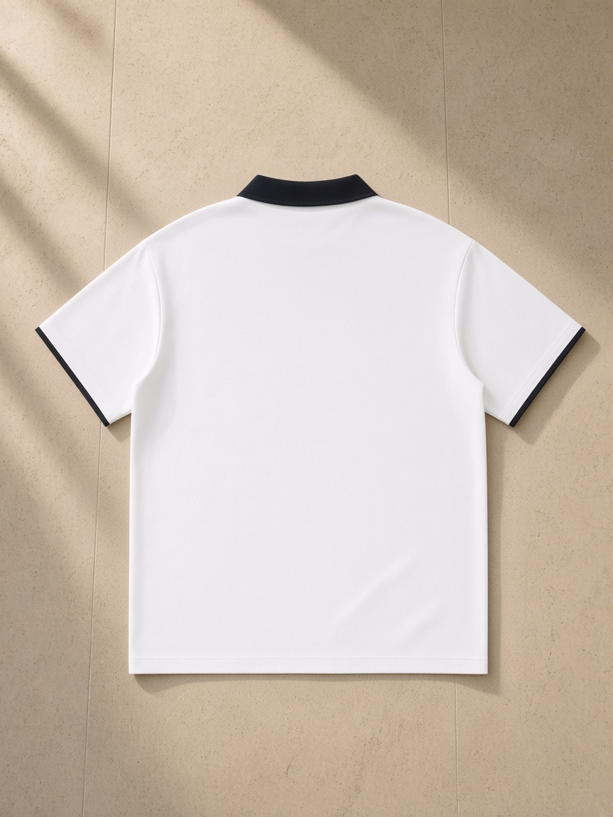 Contrast Collar Raglan Polo Shirt in White, laid flat on pale limestone, back view