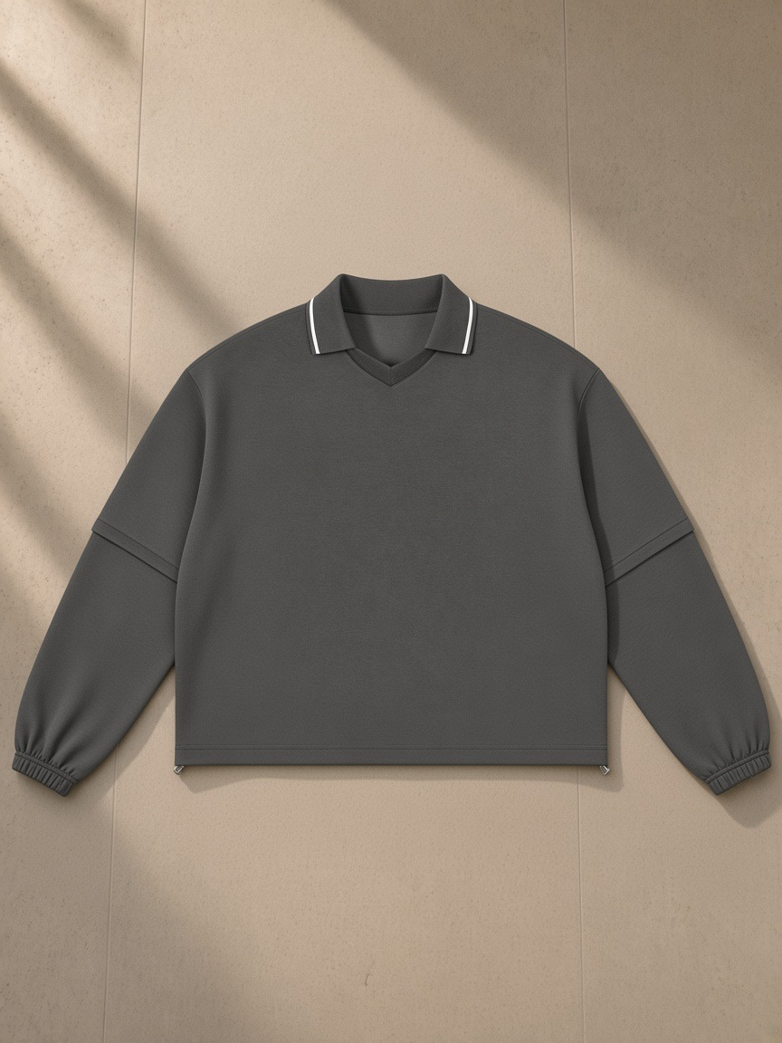 Boxy Detachable Collar Sweatshirt in Dark Gray, laid flat on pale limestone