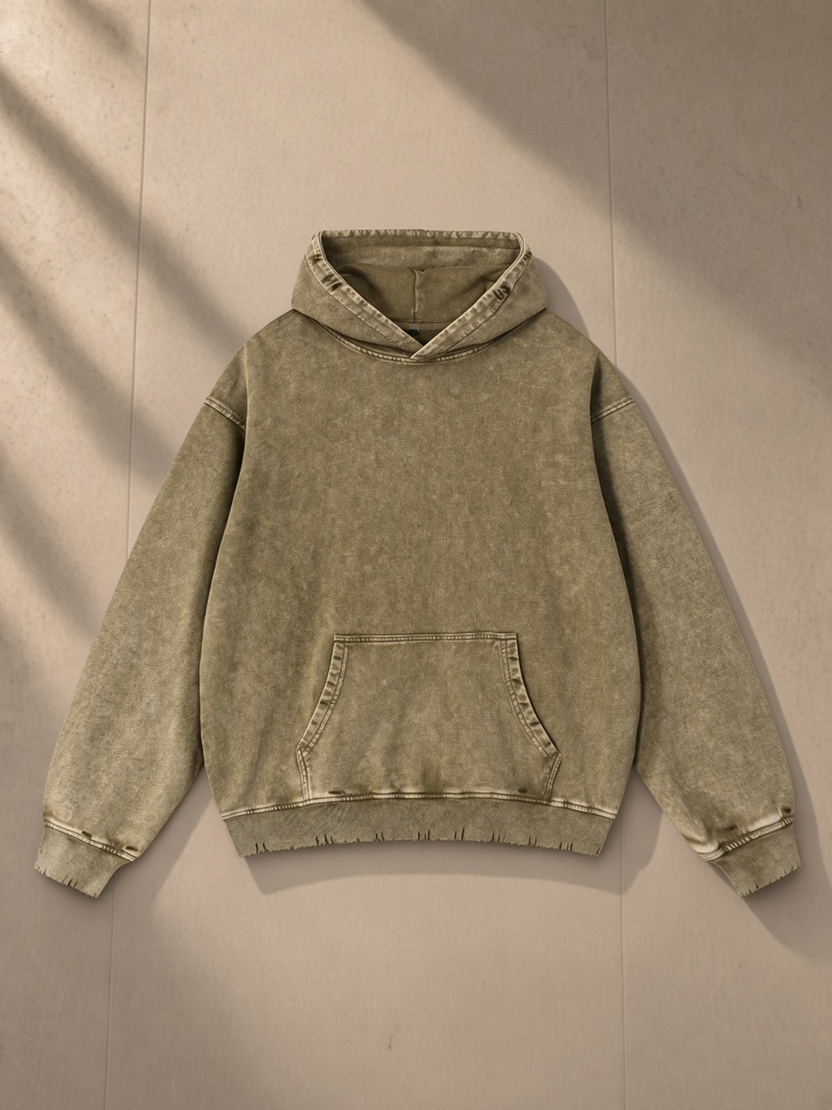 Snow Wash Hand-Frayed Heavyweight Hoodie in Brown, laid flat on pale limestone, front view