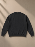 Vintage Washed Fleece Baseball Jacket in Black, laid flat on pale limestone, back view