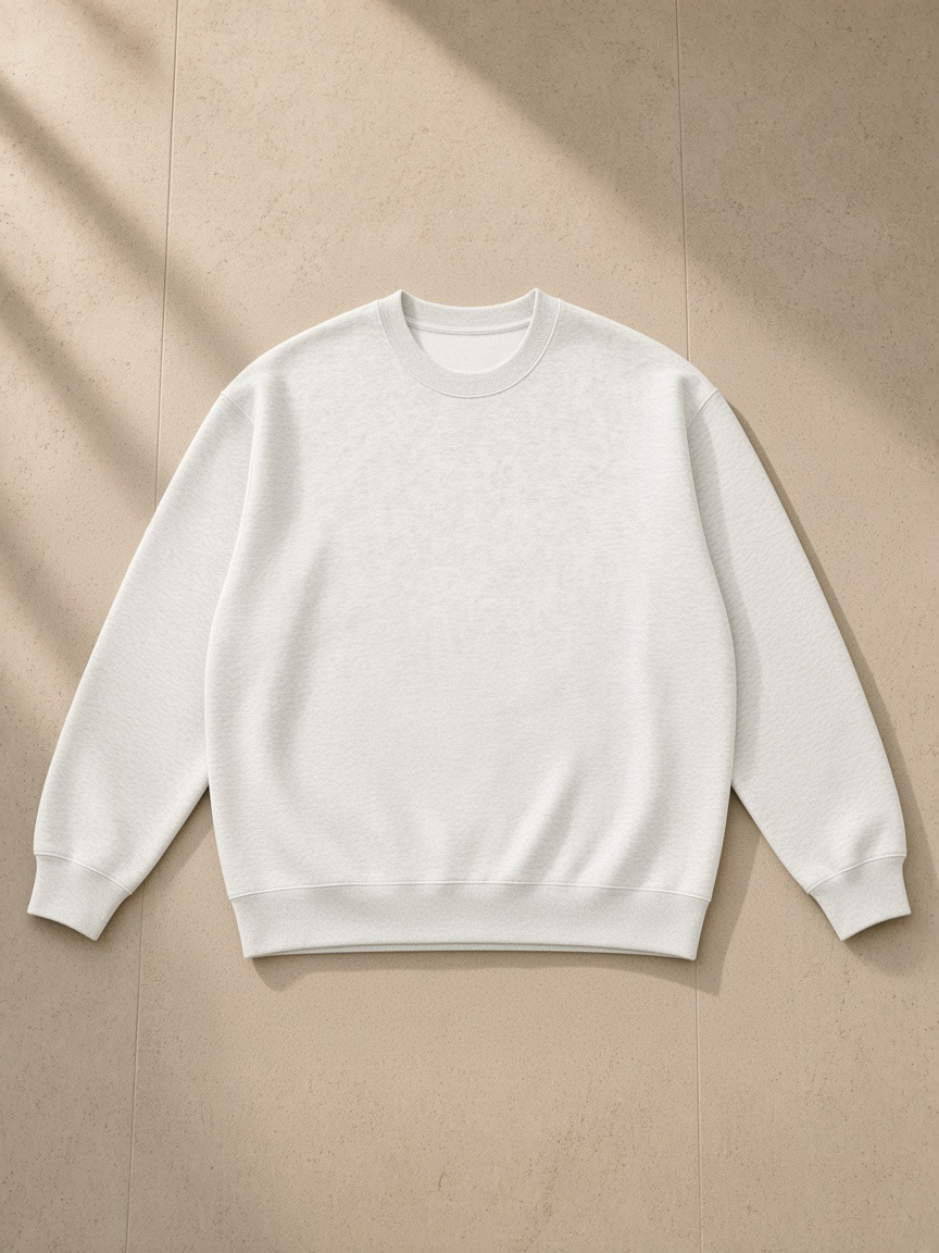 Oversized Drop Shoulder Crewneck Sweatshirt in Oat Gray, laid flat on pale limestone, front.