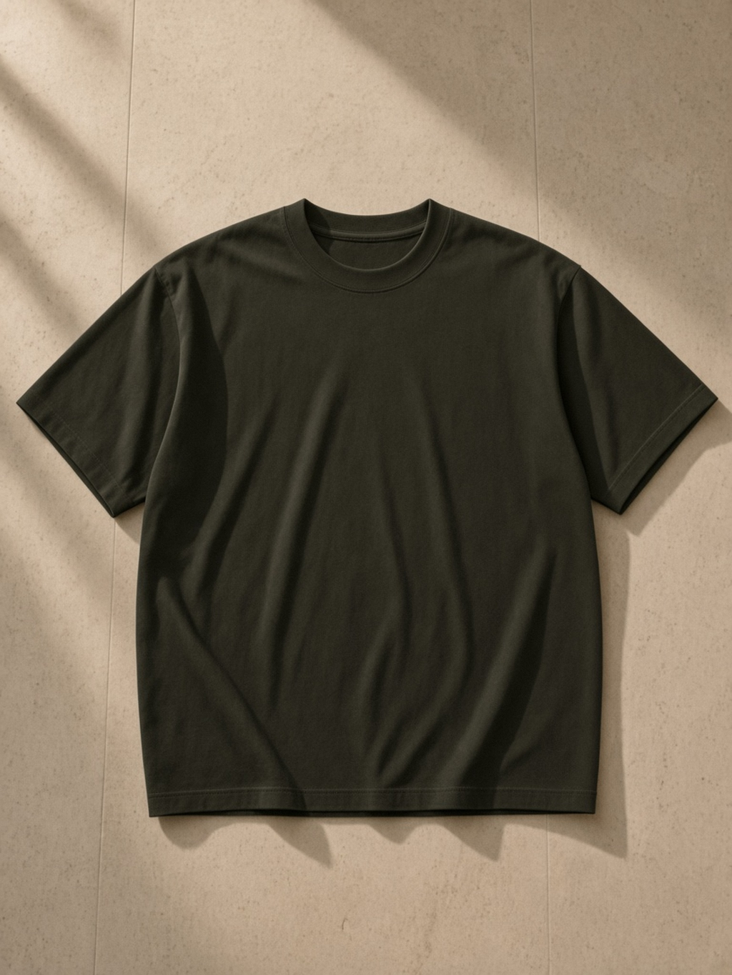 Sorona Quick-Dry T-Shirt in Olive Green, laid flat on pale limestone, front.