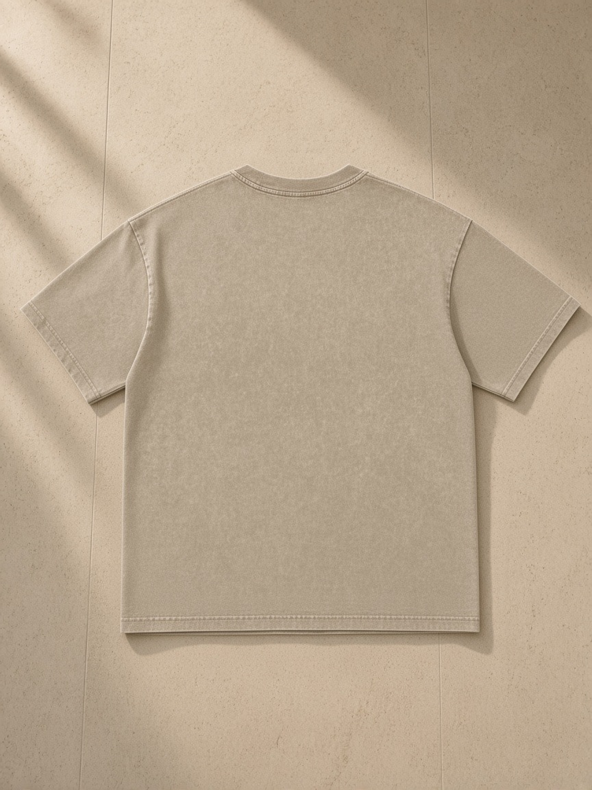Women's Snow Washed Heavyweight Oversize T-Shirt in Khaki, laid flat on pale limestone, back view