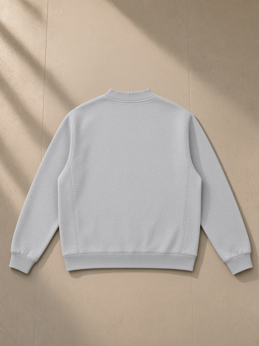 Heavyweight sweat cardigan in Flower Gray, laid flat on pale limestone, back view