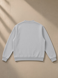 Heavyweight sweat cardigan in Flower Gray, laid flat on pale limestone, back view