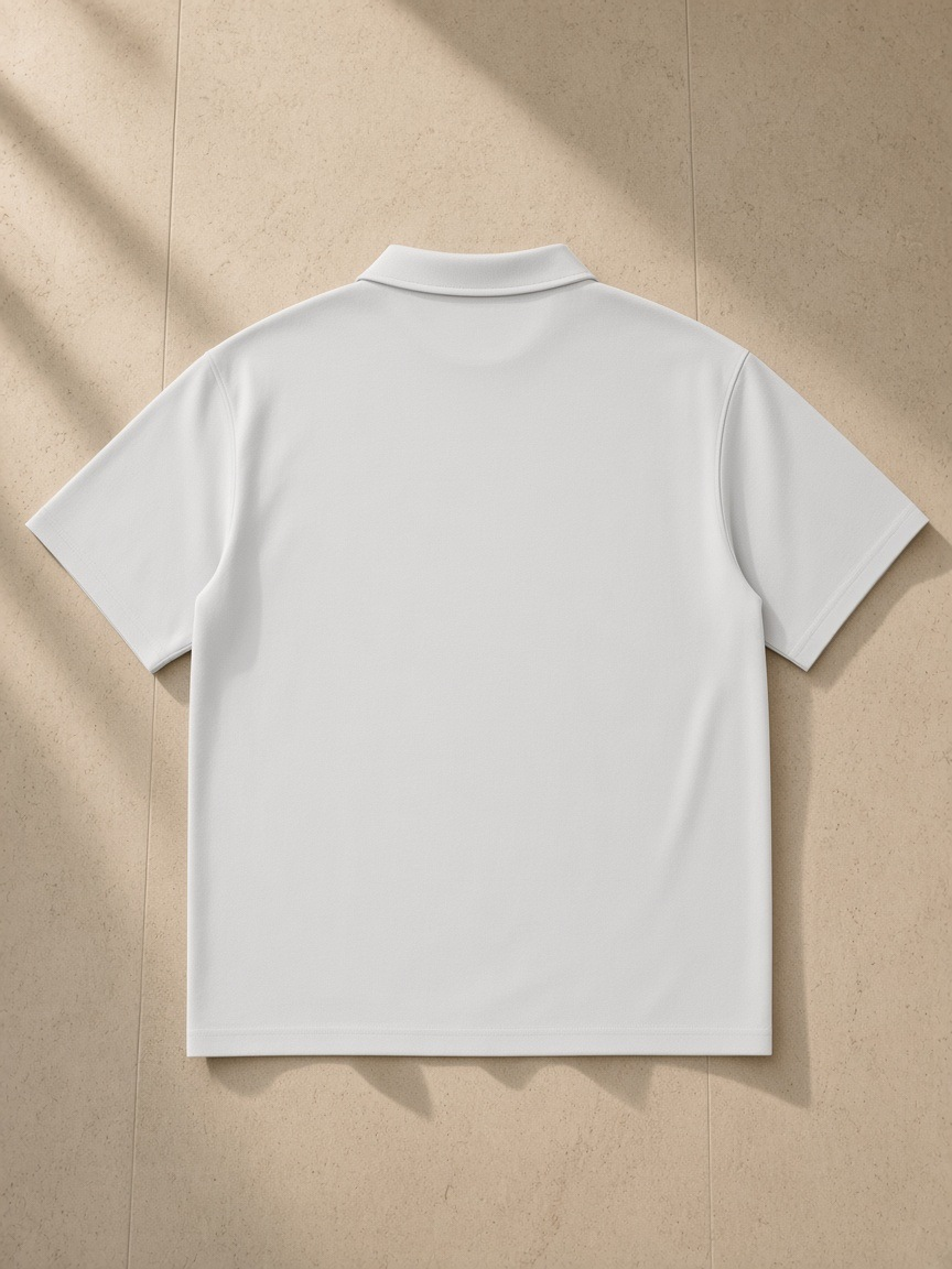 Quarter-Zip Knit Polo in Light Gray, laid flat on pale limestone, back view