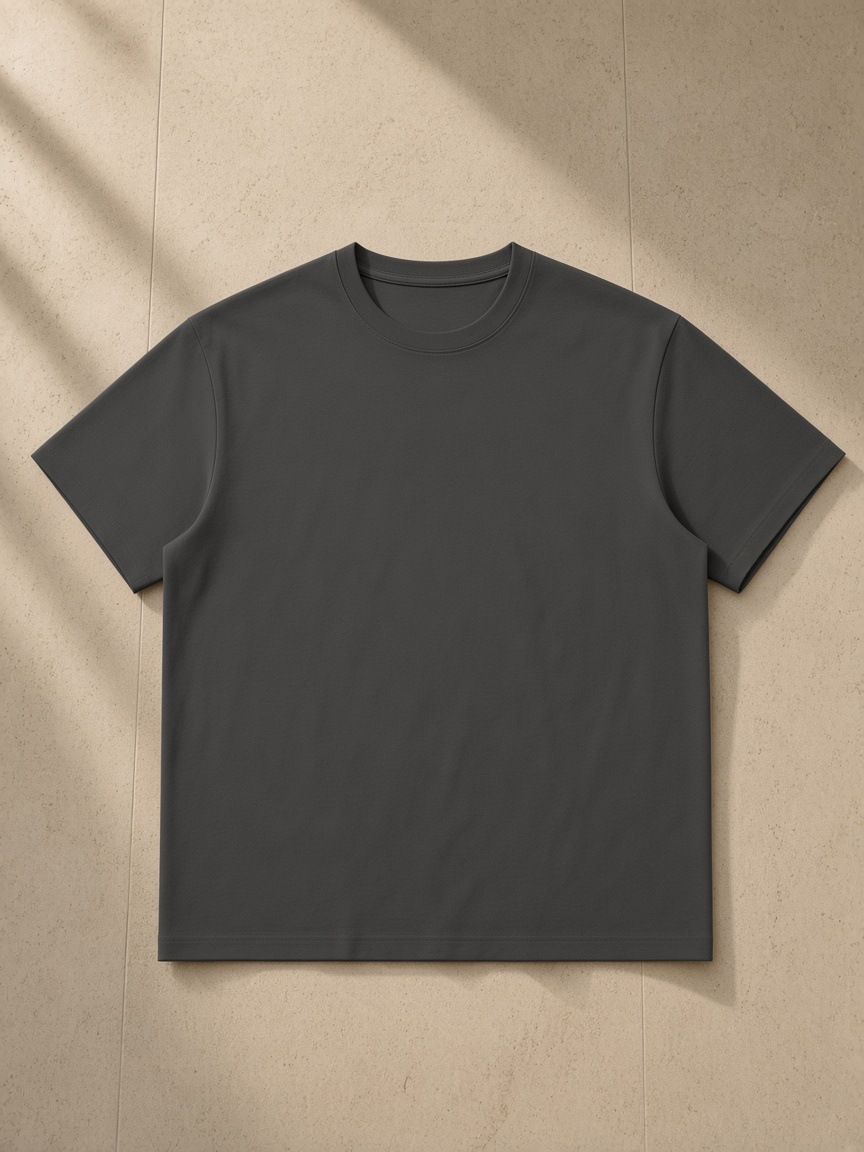 Unisex Regular Fit Coolmax T-Shirt in Dark Gray, laid flat on pale limestone