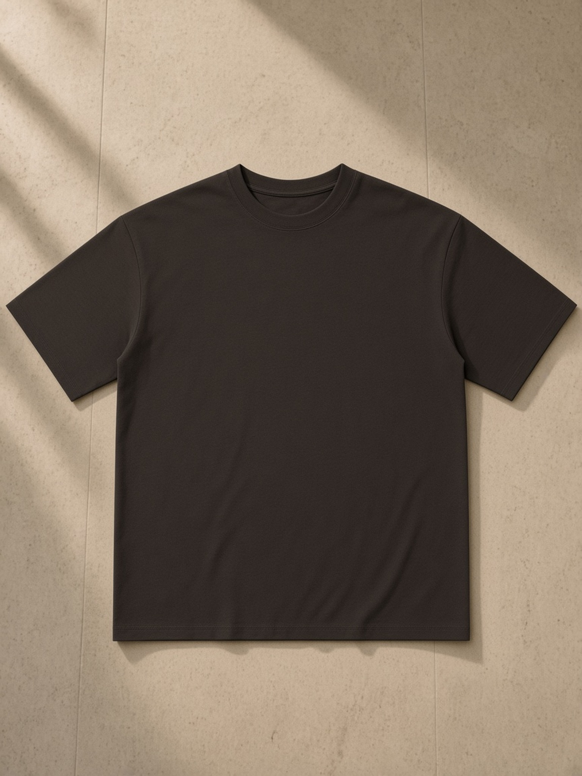 Sorona Quick-Dry T-Shirt in Coffee, laid flat on pale limestone, front.