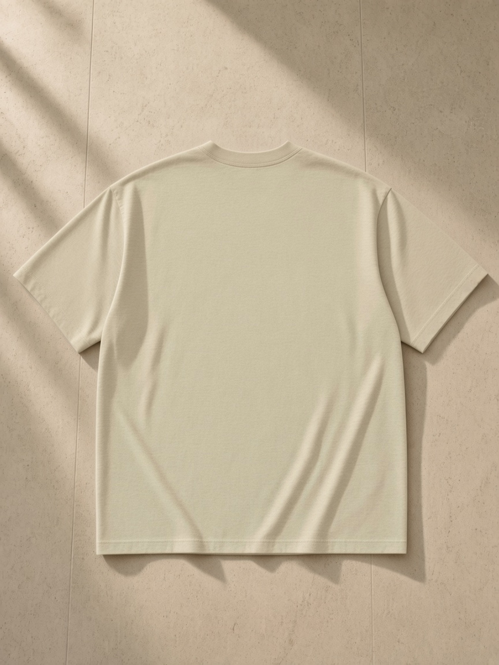 London heavyweight drop-shoulder tee in Pale Khaki, back view, plain back