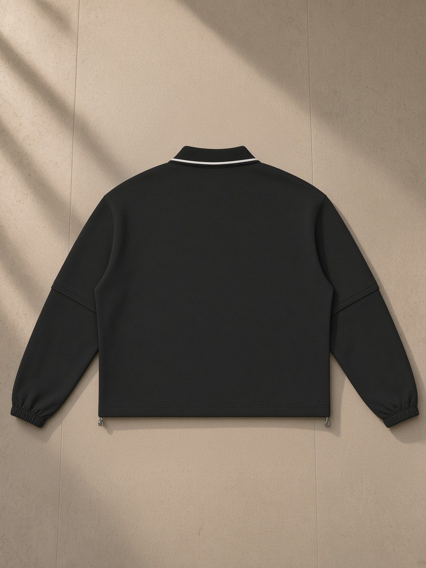 Boxy Detachable Collar Sweatshirt in Black, laid flat on pale limestone, back view