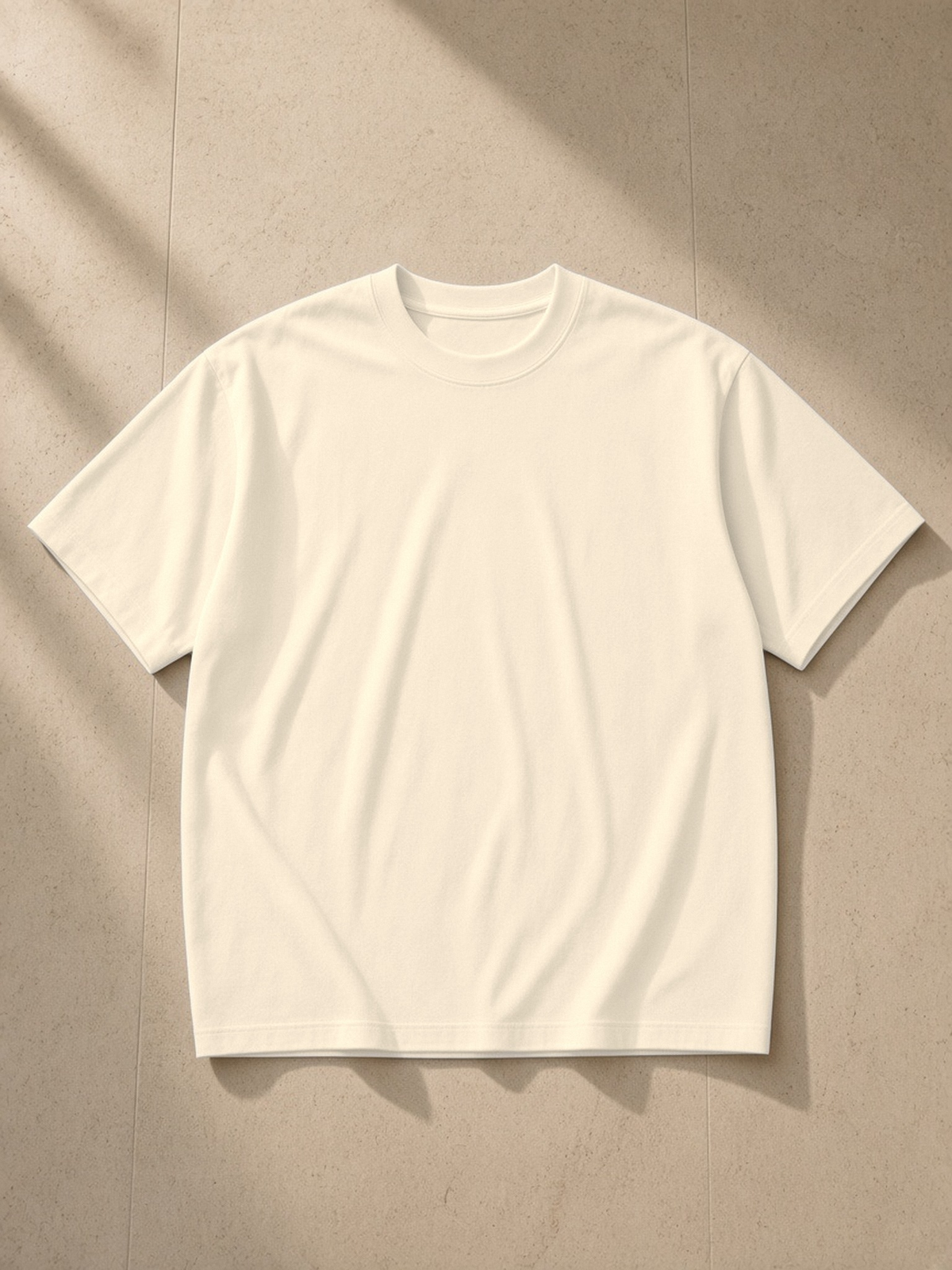 Sorona Quick-Dry T-Shirt in Apricot, laid flat on pale limestone, front.