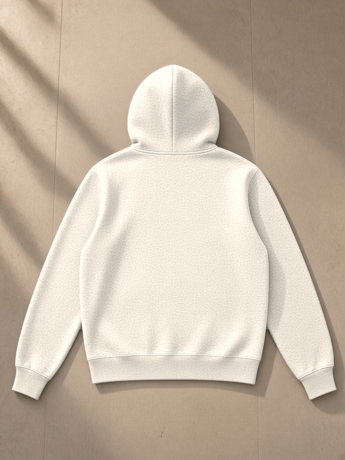 Fleece Full Zip Hoodie in Apricot, laid flat on pale limestone, back.