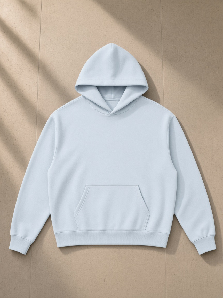 Essential Boxy Heavyweight Drop-Shoulder Hoodie in Blue, laid flat on pale limestone