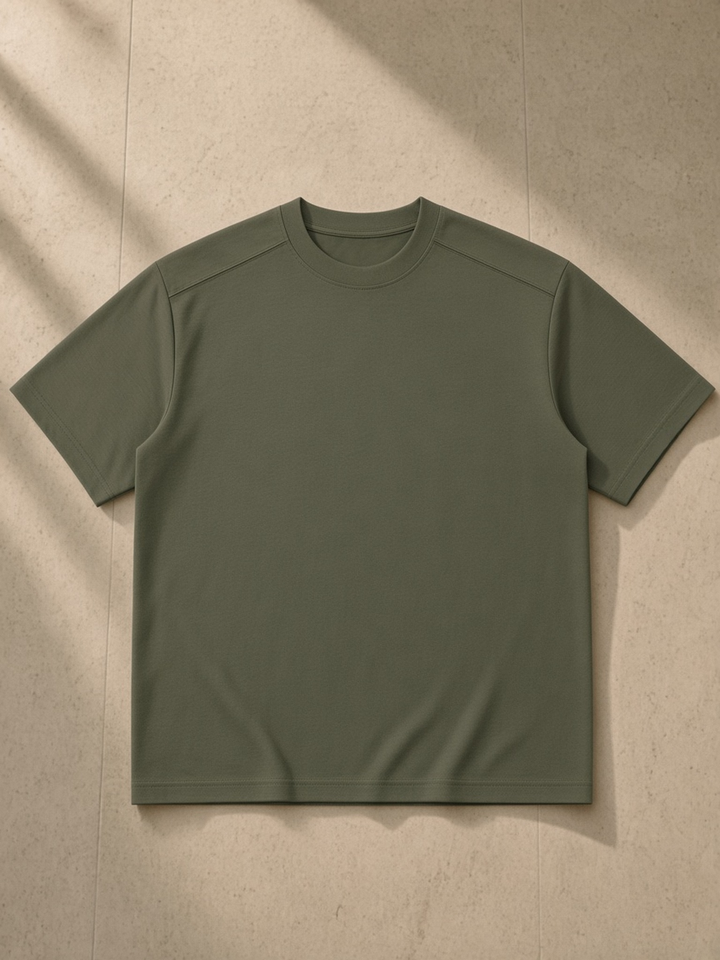Sorona Quick-Dry Loose Fit Boxy T-Shirt in Army Green, laid flat on pale limestone, front.