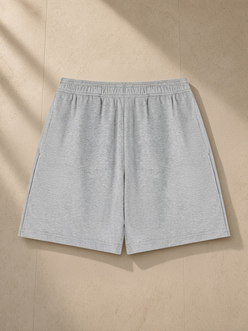 Cotton Shorts in Flower Gray, laid flat on pale limestone