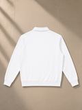 Vintage wash quarter-zip sweatshirt in White, laid flat on pale limestone, back view