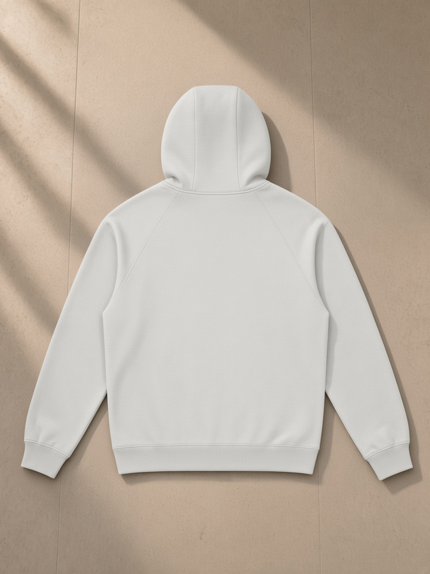 Oversized Raglan Pullover Hoodie in Light Gray, laid flat on pale limestone, back view