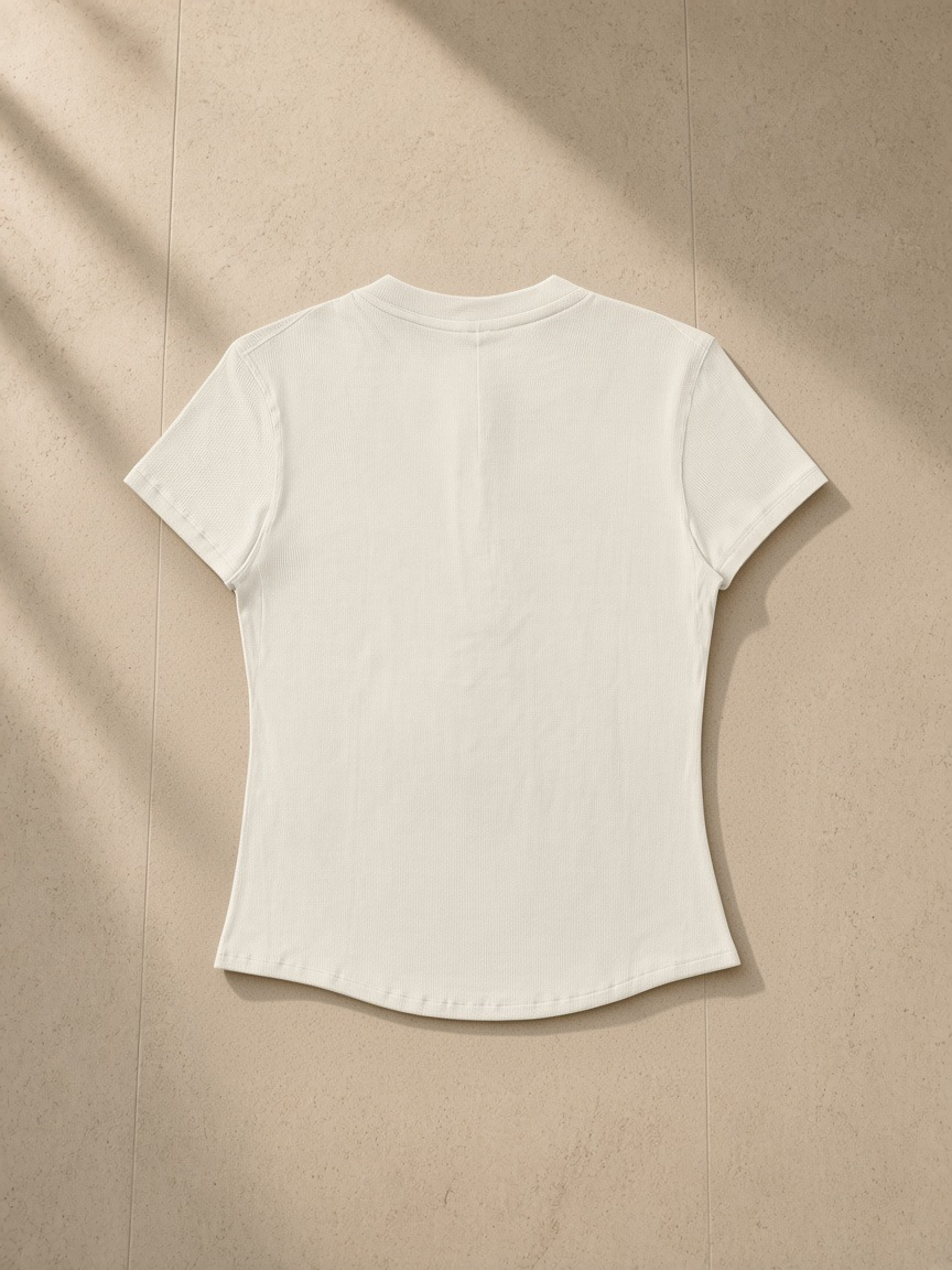 Modal bodycon henley shirt in Ivory White, laid flat on pale limestone, back view