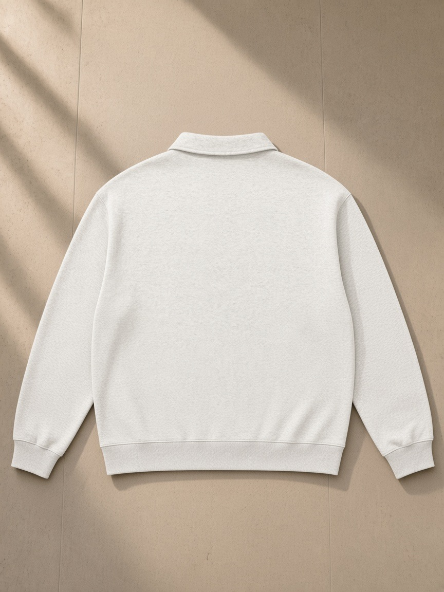 Oversized Collared Sweatshirt in Oat Gray, laid flat on pale limestone, back view