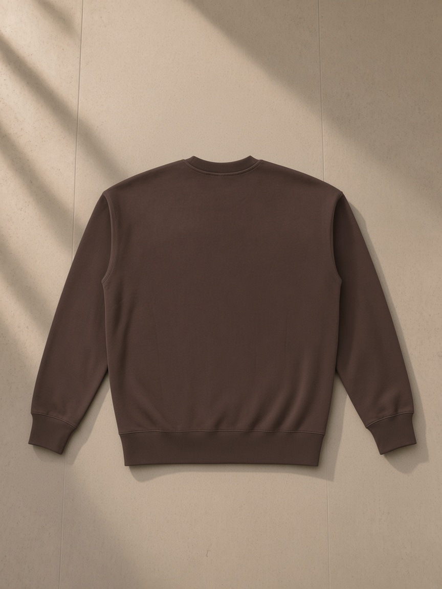 Essential Heavyweight Cotton Sweatshirt in Coffee, laid flat on pale limestone, back.