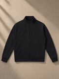 Zip-Pocket Stand Collar Jacket in Black, laid flat on pale limestone