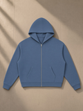 Waffle Boxy Full Zip Hoodie in Jeans Blue, laid flat on pale limestone, front.