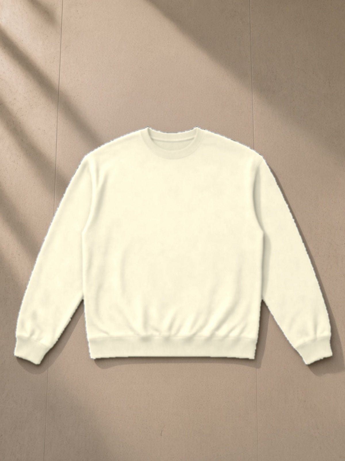 Heavyweight Crewneck Sweatshirt in Apricot, laid flat on pale limestone, front view